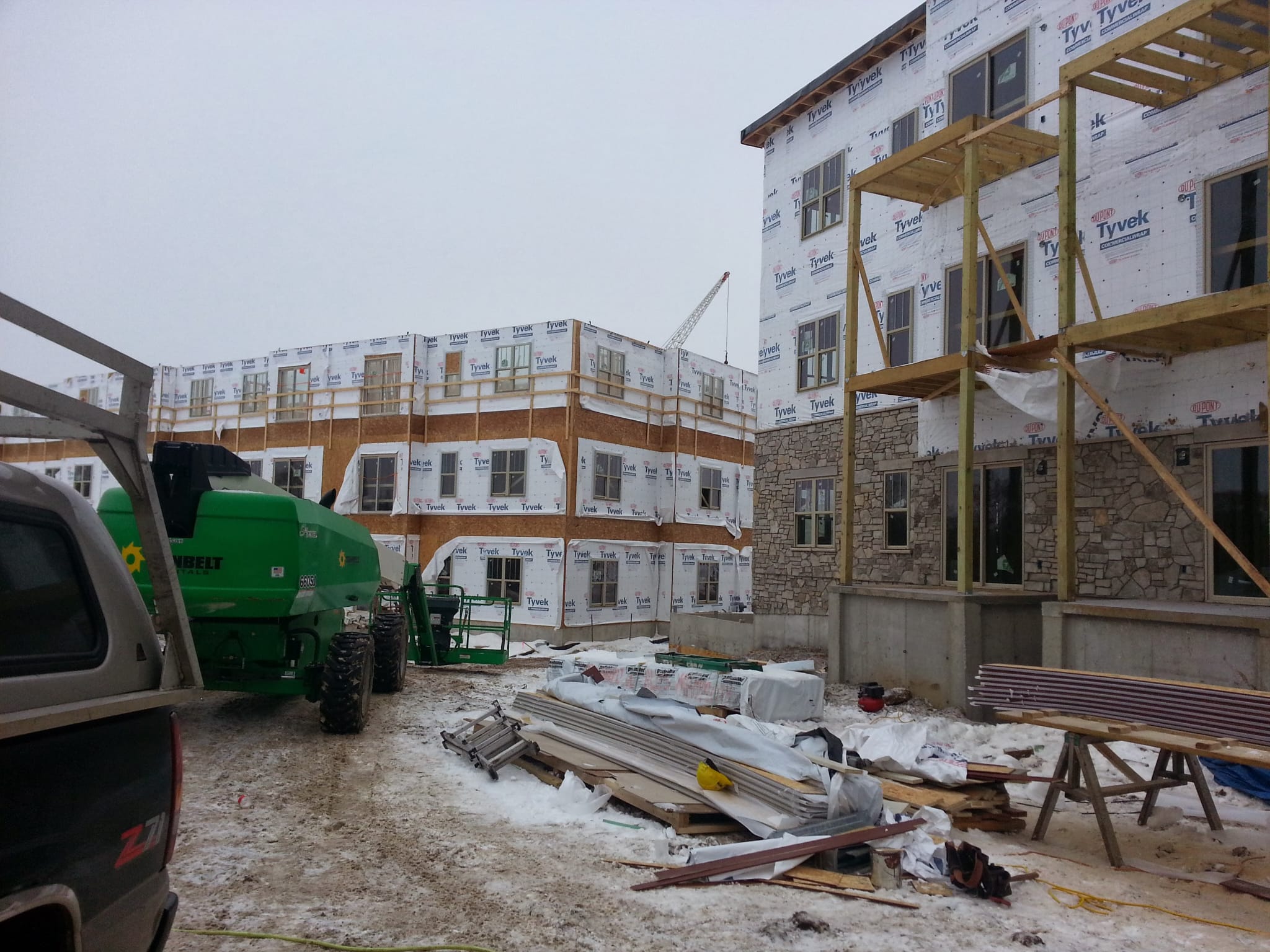 Winter jobsite with multi-family framing and siding