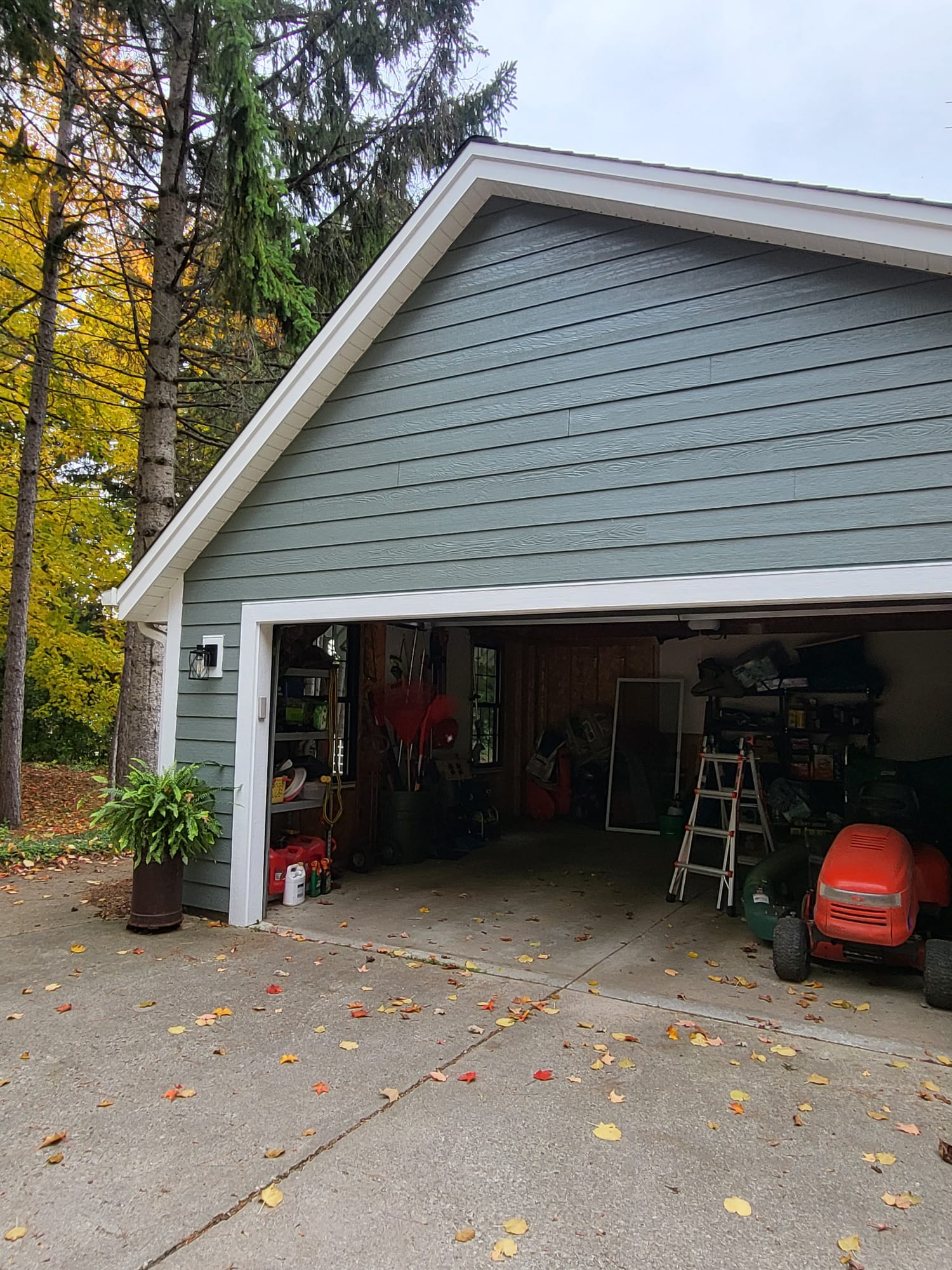 Residential home with new green siding