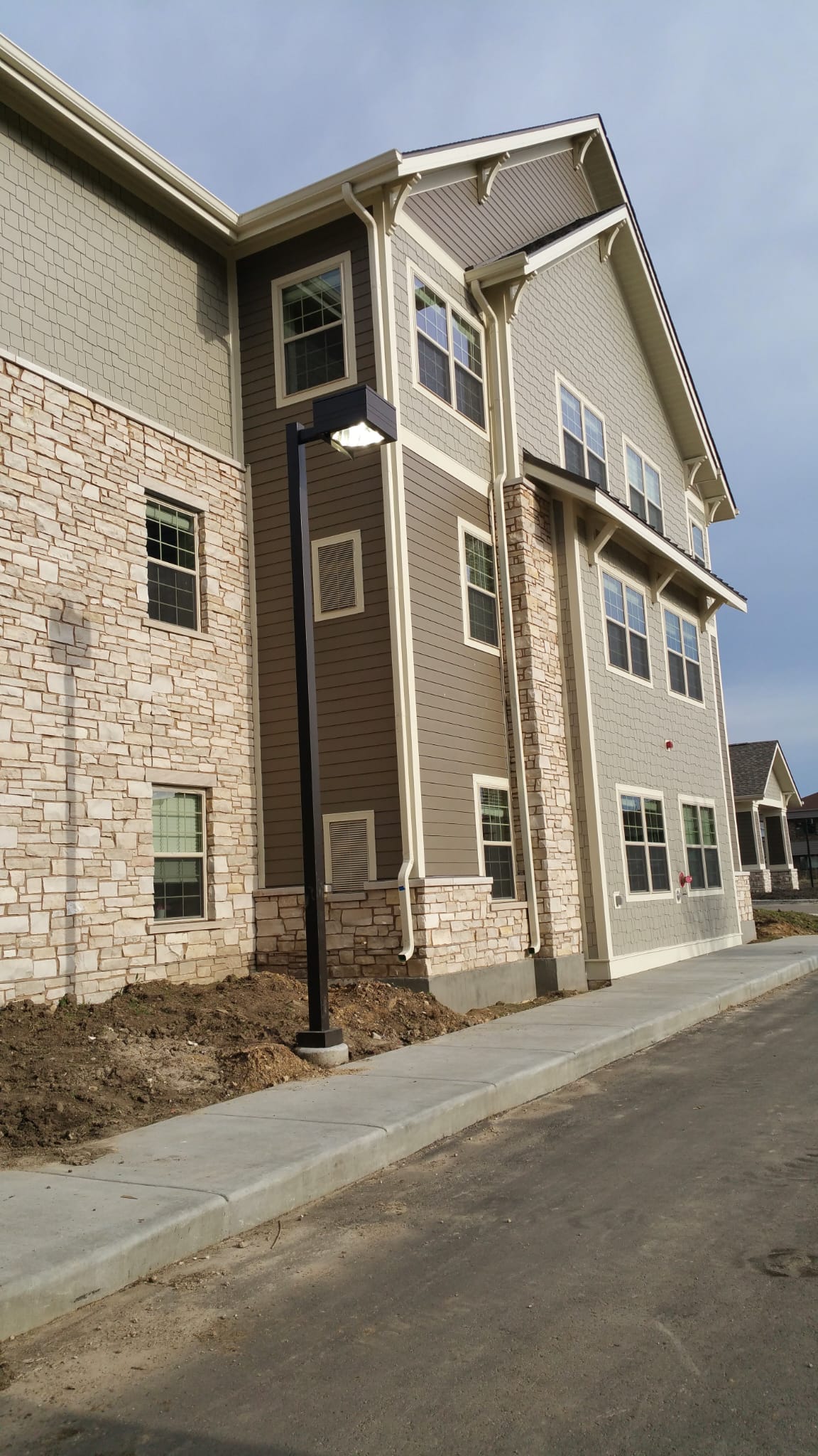 Mixed material exterior with stone and siding