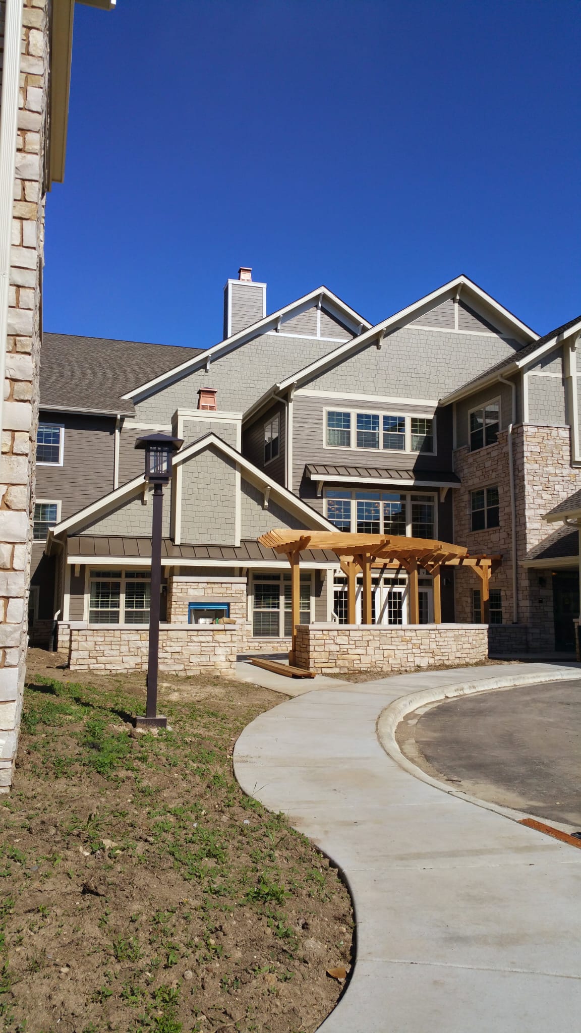 Finished multi-family residence with mixed siding and roofing